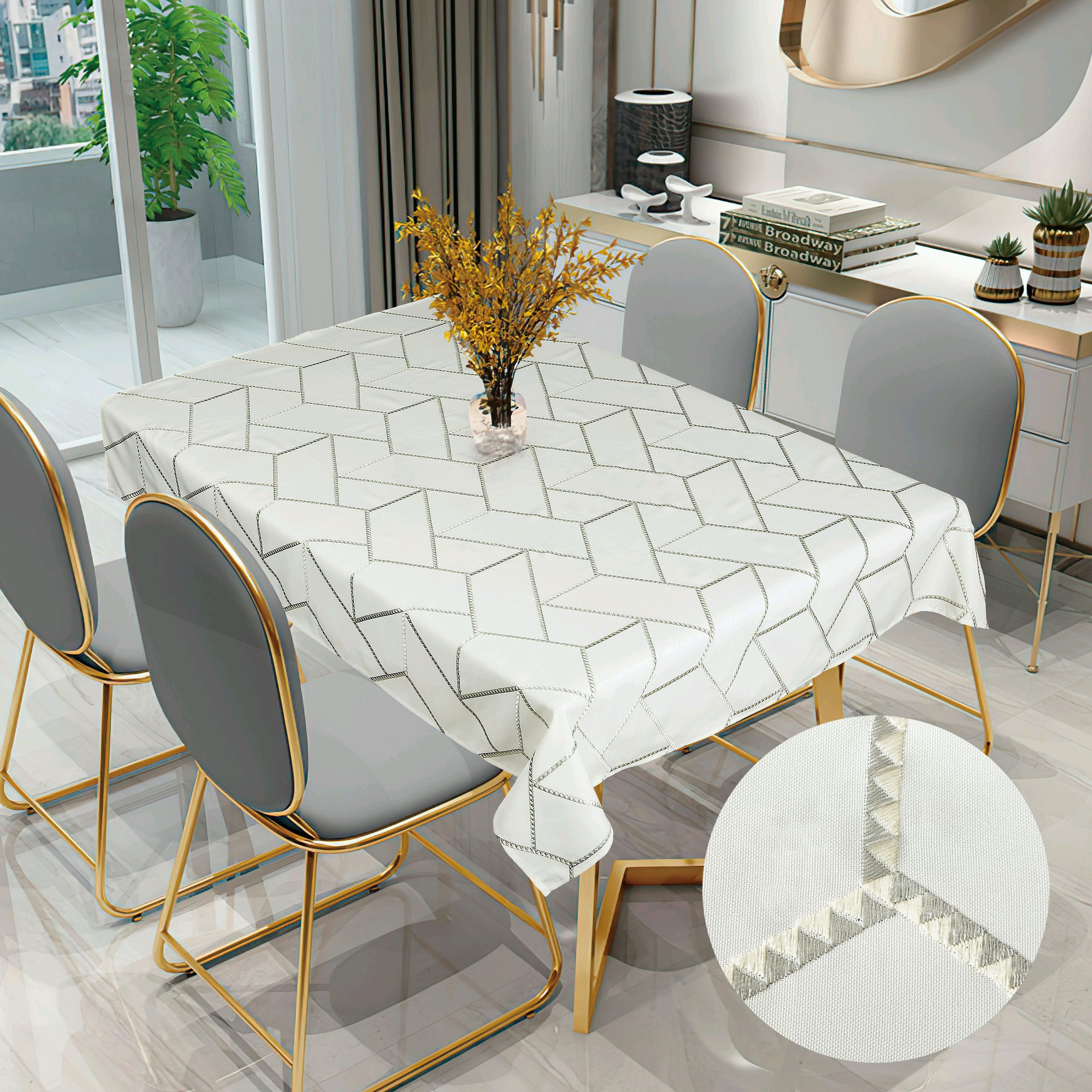 White tablecloth with an interlocking hexagon pattern in dark embroidered outline on a modern dining table