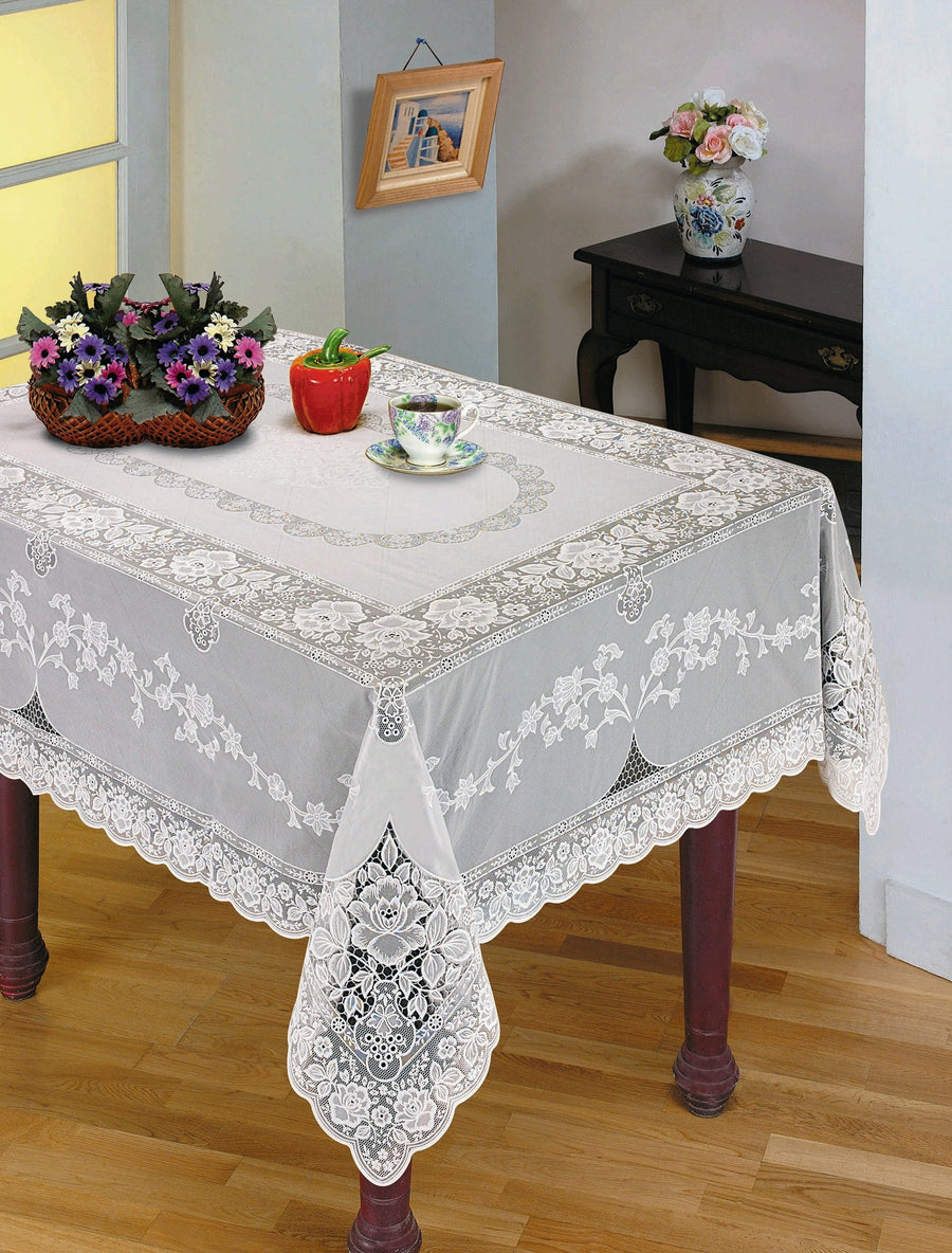 White vinyl lace tablecloth with an all-over floral openwork pattern on a table