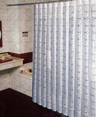 White floral vinyl lace shower curtain hanging over a bathtub