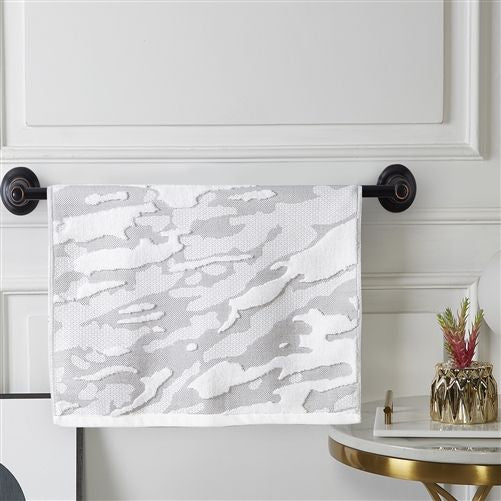 Silver-grey and white woven terry hand towel with a cloudy marbled jacquard, on a black towel bar