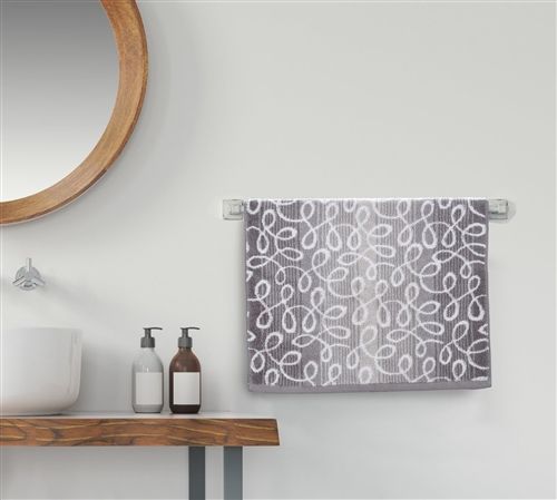 Grey terry hand towel with a white woven scroll-loop pattern on a bar