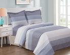 Blue and white horizontally striped duvet set with two matching shams on a bed