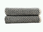 Black and white woven chevron zigzag terry towels, rolled and stacked