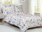 White cotton duvet set printed with soft watercolour flowers in blue, purple, pink and yellow, with two matching shams