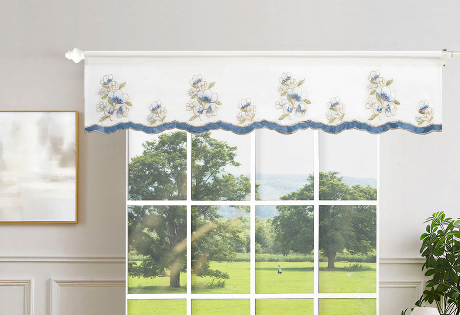 White sheer valance embroidered with white-and-blue blossoms and a blue scalloped border