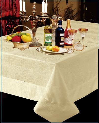 Ivory tablecloth with a tone-on-tone crocodile-skin embossed pattern on a formal dining table