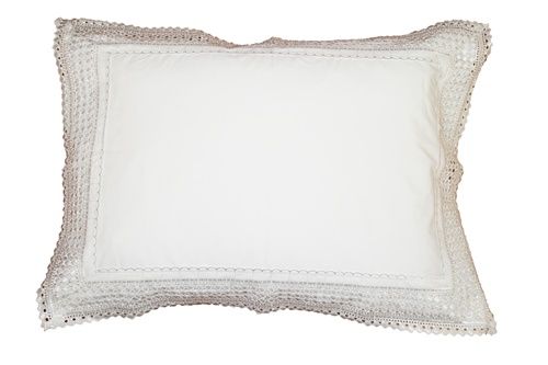 Solid white pillow with a wide flat border and crochet lace edging