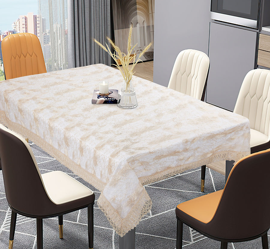 Ivory tone-on-tone damask tablecloth with a crochet lace edge on a rectangular dining table