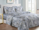 Blue-grey cotton-sateen duvet set printed with dense clusters of small white blossoms, matching shams