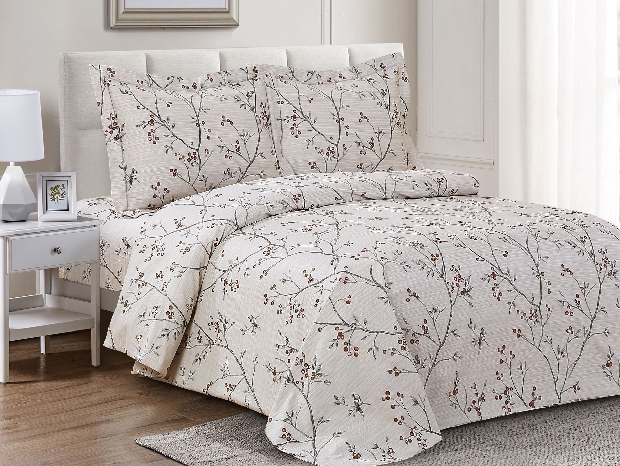 Cream cotton duvet set printed with slender branches, small berries and perched birds, with two matching shams