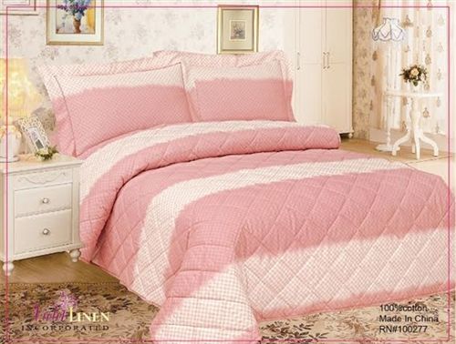 Pink quilted bedding with gingham check and solid rose bands, with matching shams
