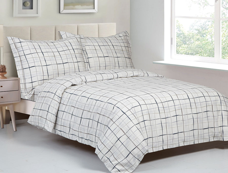 White cotton duvet set printed with a hand-drawn navy windowpane grid check, with matching shams