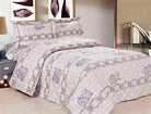 Beige quilt with a mauve damask medallion pattern and matching shams