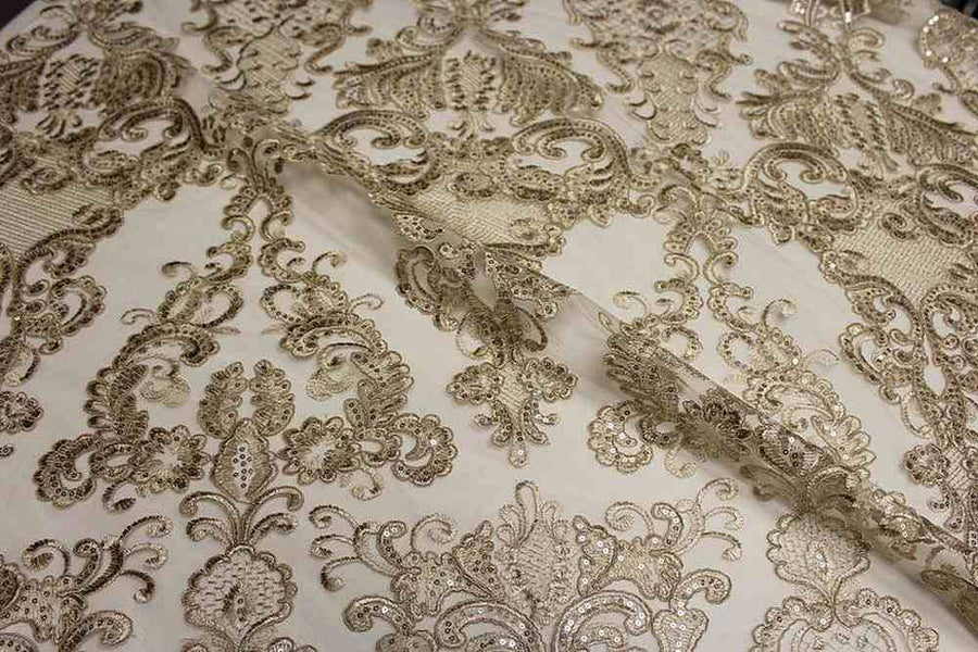 Gold Damask Fabric featuring intricate floral patterns and elegant designs.
