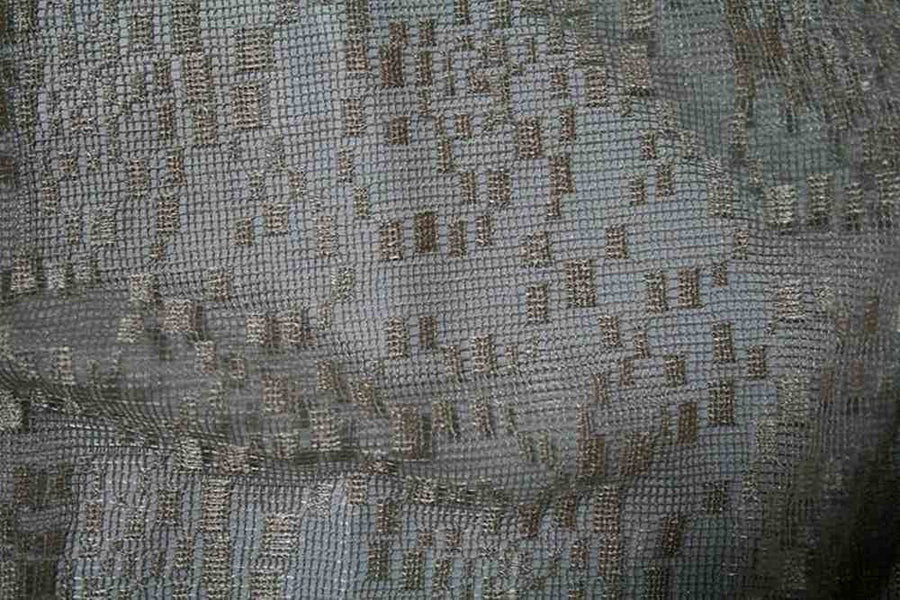 Textured fabric with a subtle pattern, ideal for upholstery or fashion design.