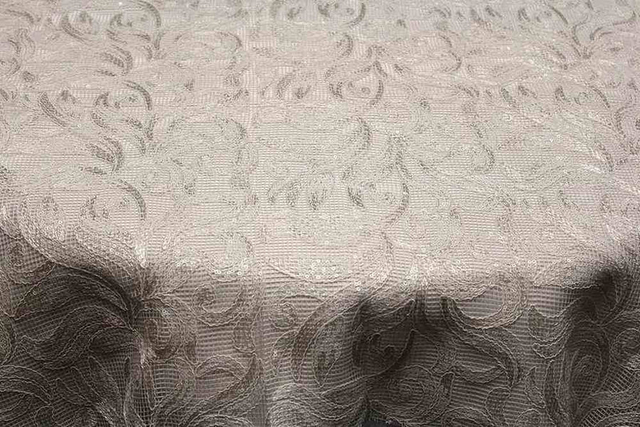 Elegant lace tablecloth featuring intricate floral patterns in soft beige tones.
