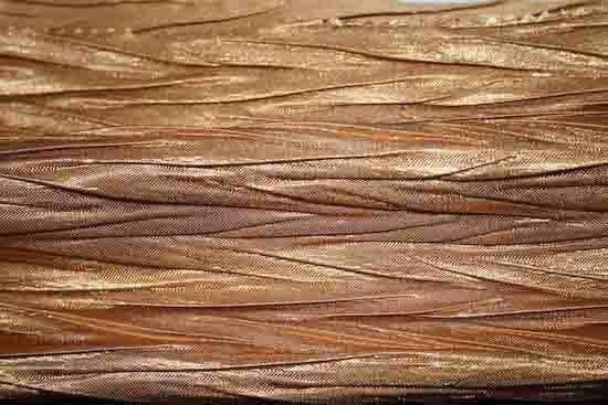 Metallic Gold Craft Ribbon features a shimmering finish and intricate woven texture.