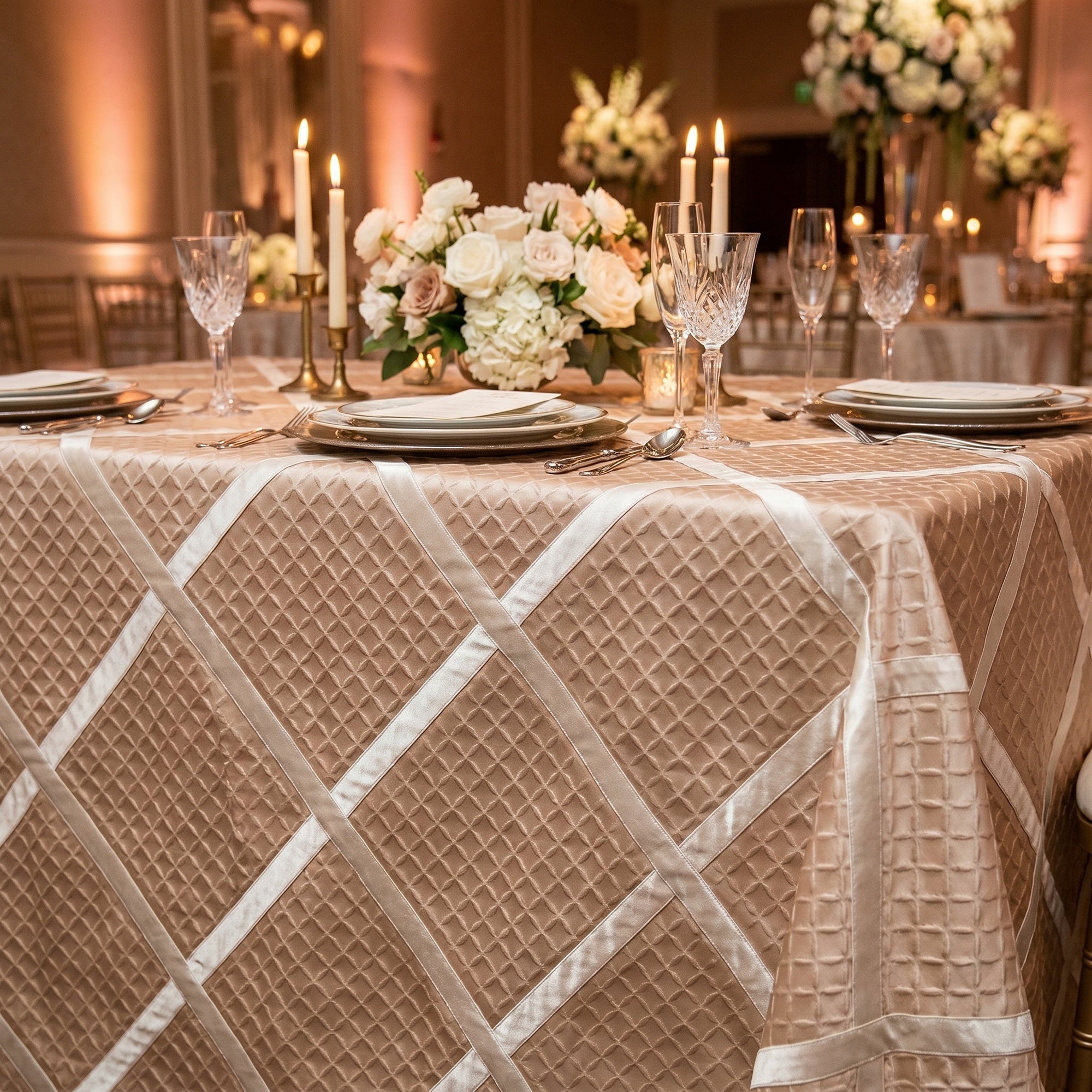 Blush ribbon-lattice tablecloth at a wedding